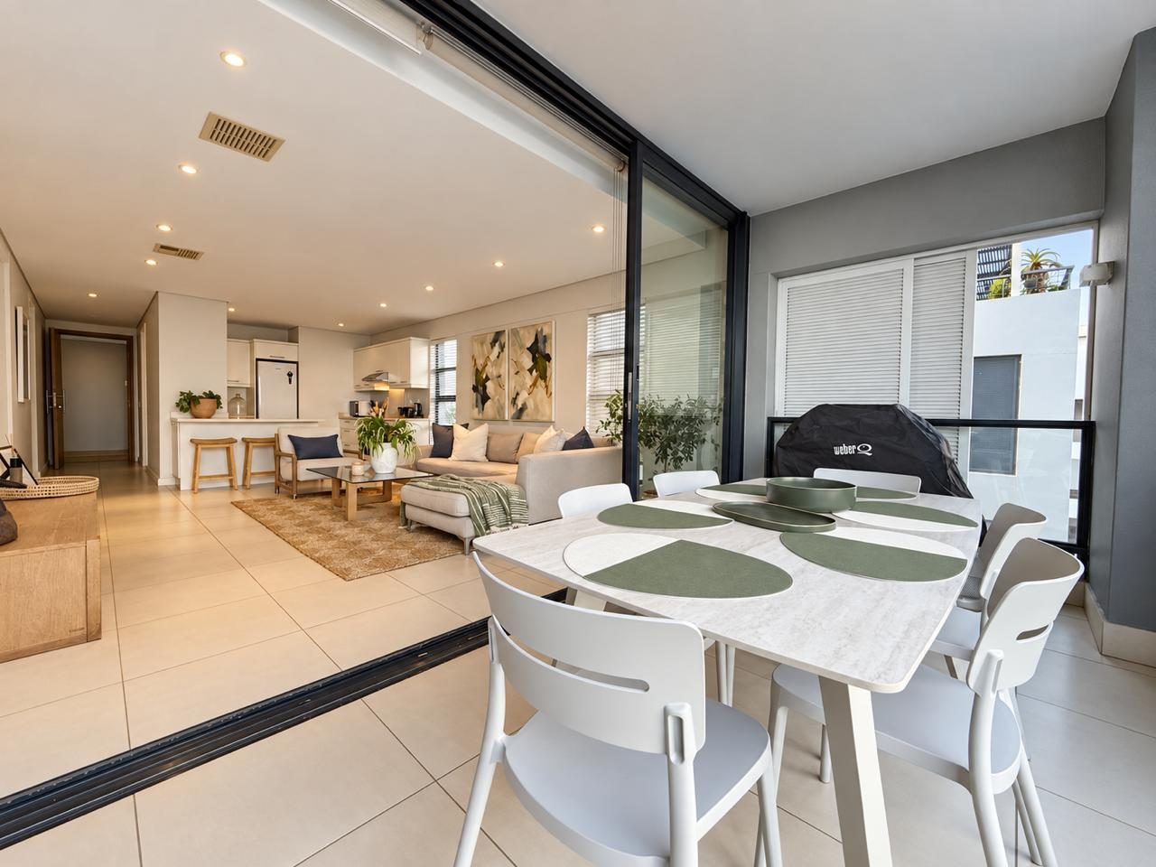 Balcony dining table opening to the lounge
